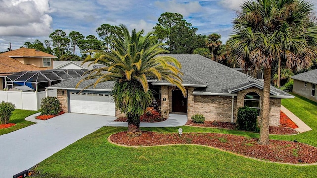 view of front of house featuring a garage and a front yard