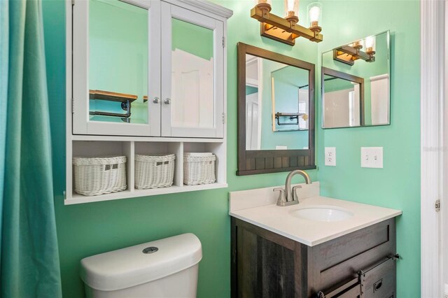 bathroom with vanity and toilet