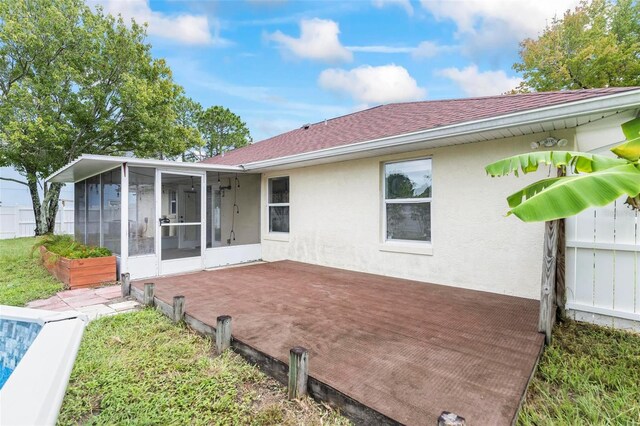 back of property featuring a sunroom