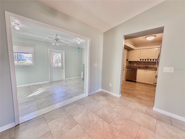 tiled spare room with ceiling fan and lofted ceiling