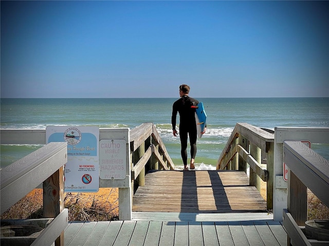 view of community with a view of the beach and a water view