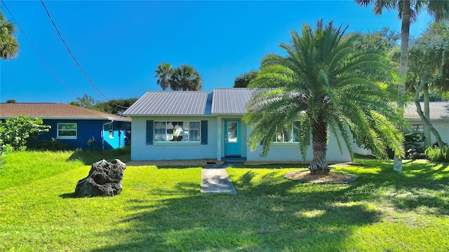 ranch-style home with a front lawn