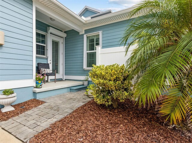 doorway to property featuring covered porch