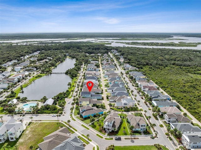 birds eye view of property featuring a residential view and a water view