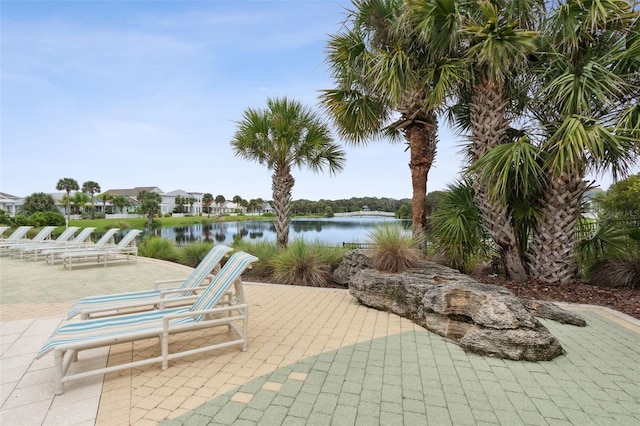 view of patio with a water view