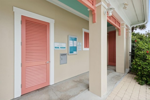 doorway to property with stucco siding