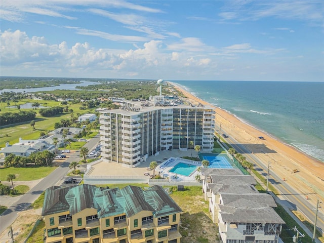 drone / aerial view with a water view and a view of the beach