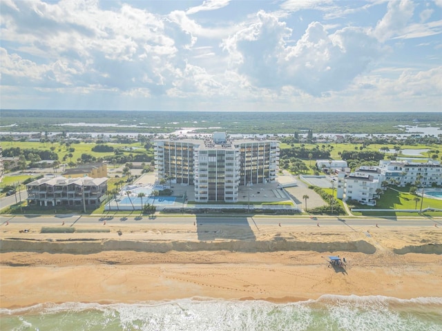 drone / aerial view with a view of the beach and a water view