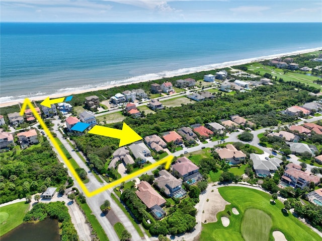 aerial view with a water view and a beach view