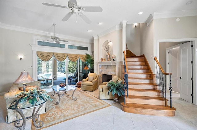 interior space featuring ceiling fan, crown molding, and light tile patterned flooring