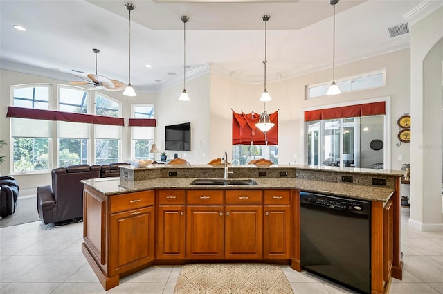 kitchen featuring a center island with sink, dishwasher, ceiling fan, and sink