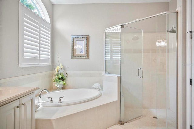 bathroom with separate shower and tub and vanity