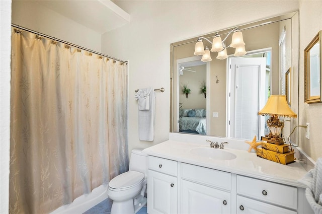 full bathroom featuring vanity, tile patterned flooring, toilet, shower / bath combo with shower curtain, and ceiling fan