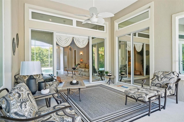 sunroom / solarium with ceiling fan