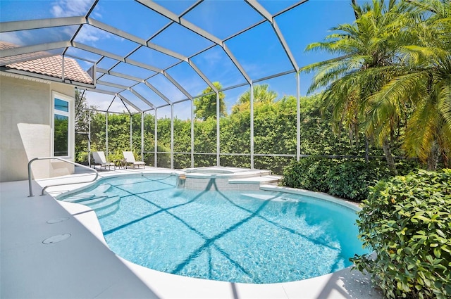 view of swimming pool featuring a lanai, a patio, and an in ground hot tub