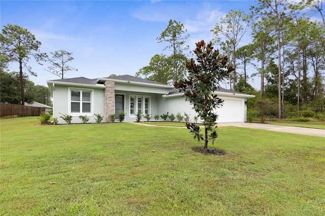 view of front of home featuring a garage and a front yard