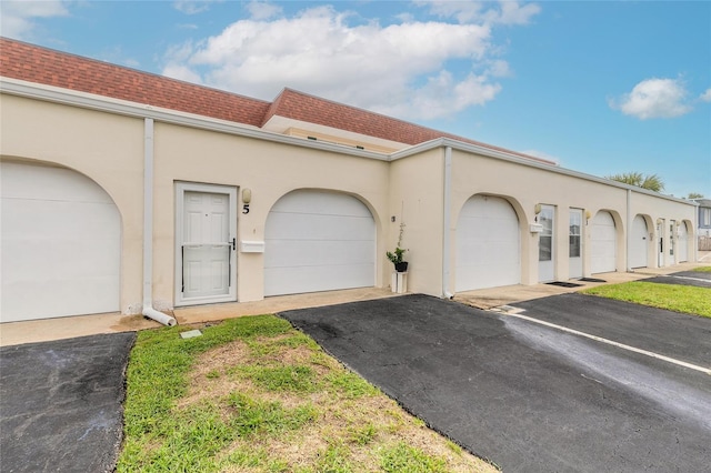 mediterranean / spanish house featuring a garage