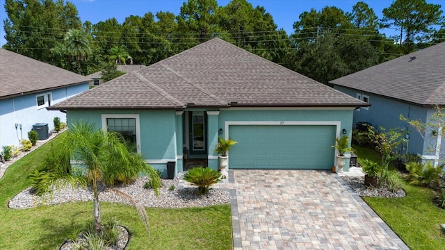 single story home with a front yard, a garage, and central air condition unit