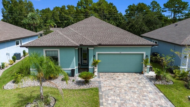 57 Green Cir, Palm Coast, FL 32164 - ranch-style home featuring a shingled roof, stucco siding, an attached garage, and central air condition unit