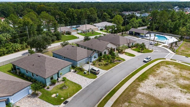 57 Green Cir, Palm Coast, FL 32164 - aerial view of residential area with a forest and a pool area