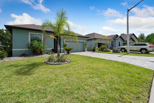 ranch-style home featuring a garage and a front lawn