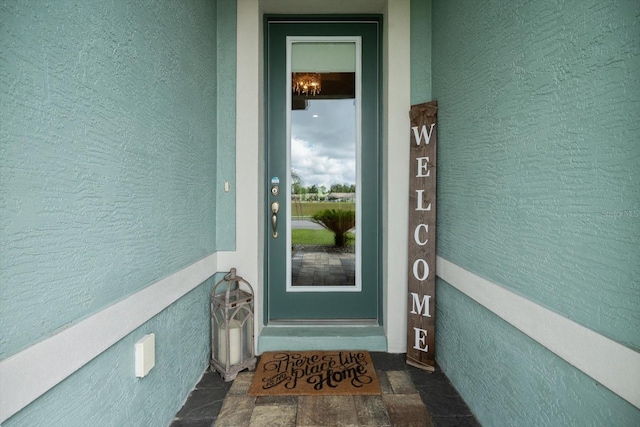 57 Green Cir, Palm Coast, FL 32164 - entrance to property with stucco siding