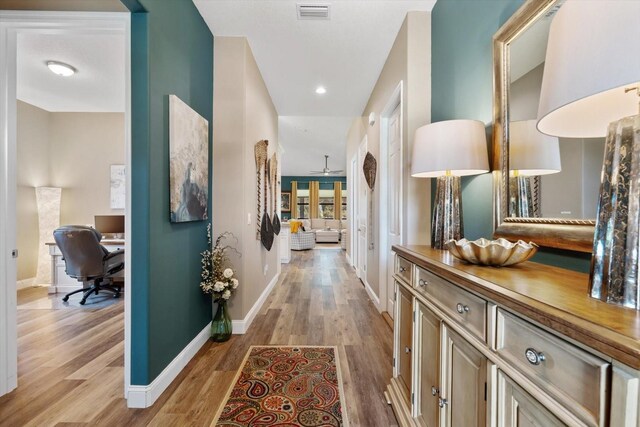 57 Green Cir, Palm Coast, FL 32164 - corridor with a desk, light wood-type flooring, baseboards, and recessed lighting