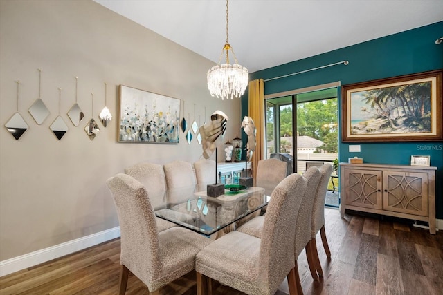 dining space featuring dark hardwood / wood-style flooring and a notable chandelier