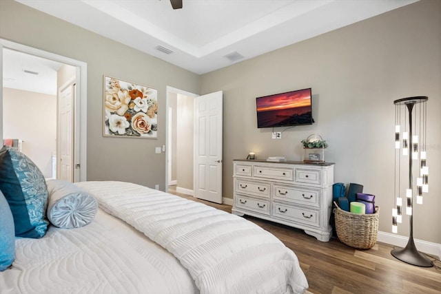 bedroom with ceiling fan and dark hardwood / wood-style flooring