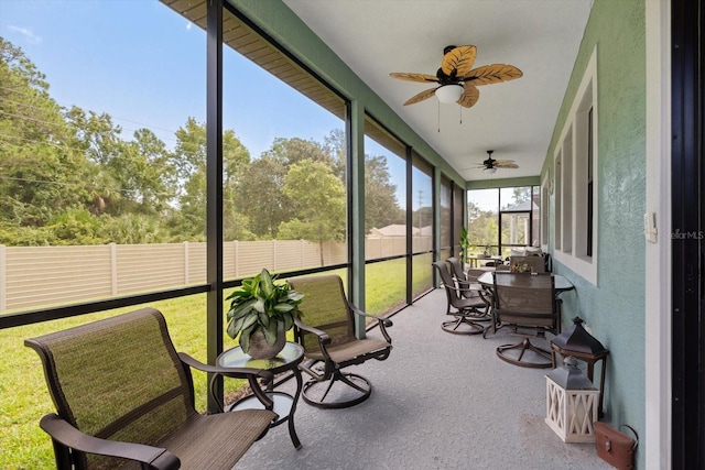 sunroom / solarium with ceiling fan