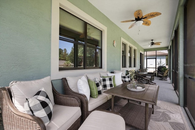 sunroom / solarium with ceiling fan