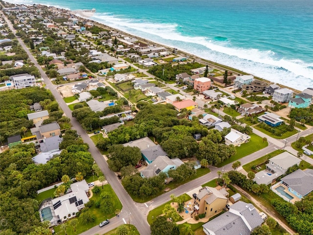 aerial view featuring a view of the beach and a water view