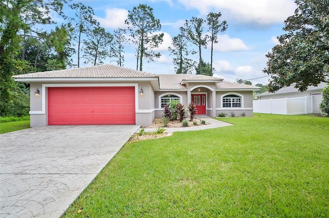 view of front of house with fence, driveway, stucco siding, a front lawn, and a tile roof