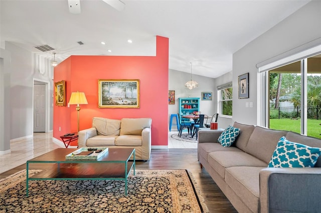 living room with hardwood / wood-style floors and ceiling fan