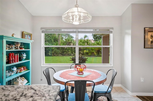 dining space with an inviting chandelier