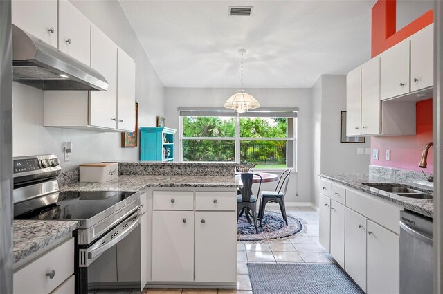 kitchen with decorative light fixtures, stainless steel appliances, white cabinetry, sink, and light tile patterned flooring