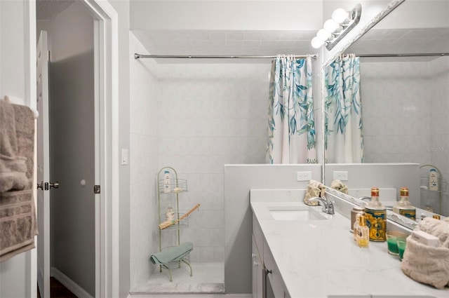 bathroom with a shower with curtain and vanity