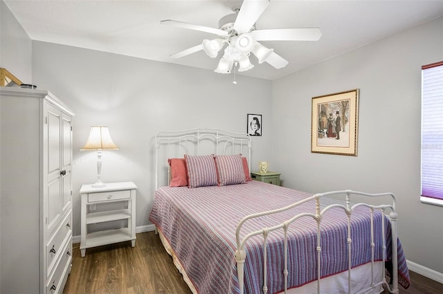 bedroom featuring ceiling fan and dark hardwood / wood-style floors