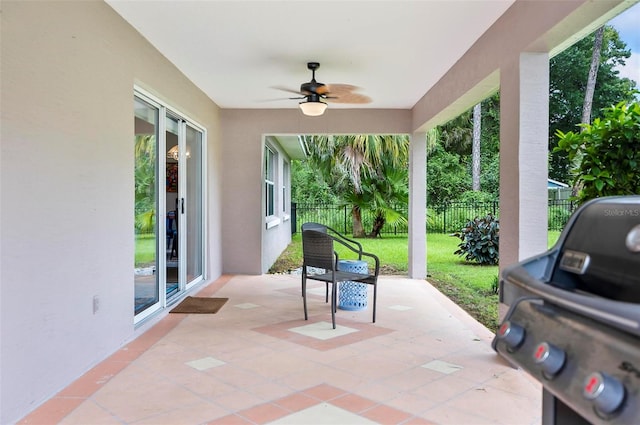 view of patio featuring ceiling fan