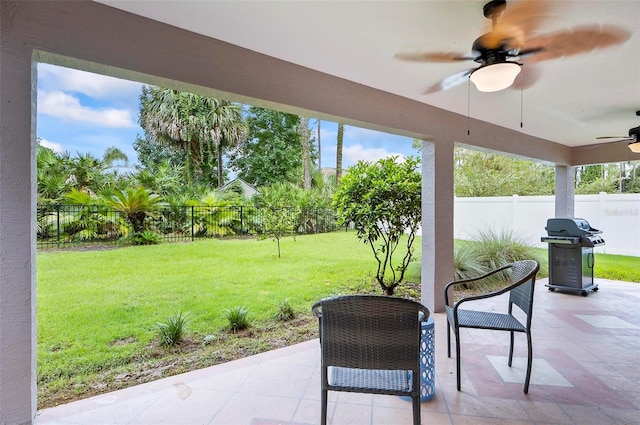 view of patio / terrace with grilling area and ceiling fan