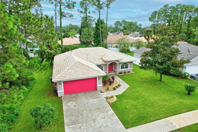 view of front of house with a front lawn and a garage