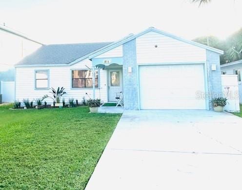 ranch-style house with a front lawn and a garage