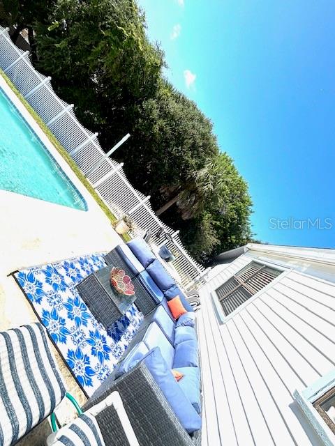 view of pool featuring an outdoor hangout area and a patio