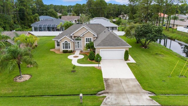 view of front of home featuring a garage and a front lawn