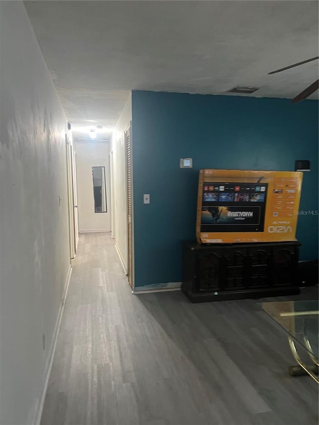 hallway featuring hardwood / wood-style flooring