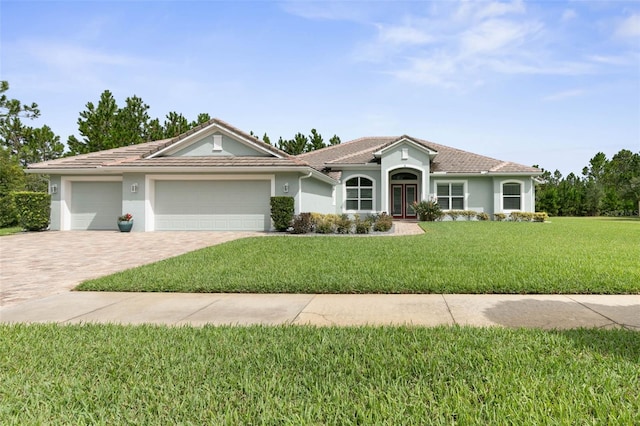 view of front facade featuring a front lawn and a garage