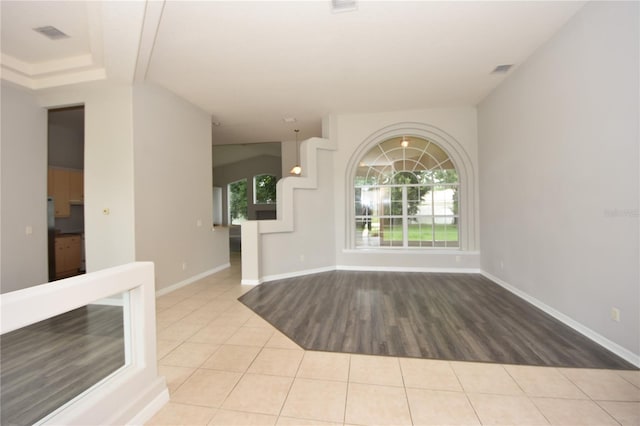 empty room with light hardwood / wood-style flooring