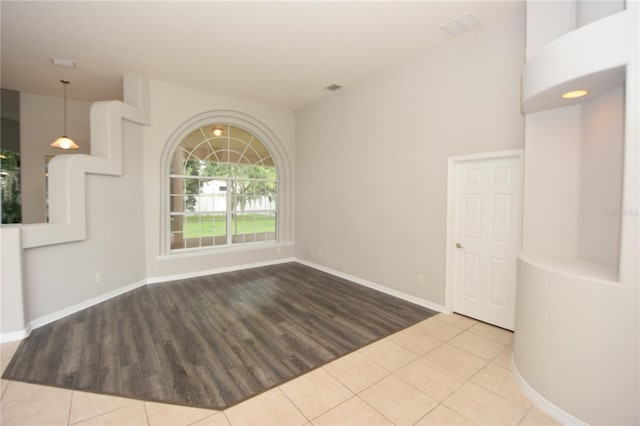 empty room with light hardwood / wood-style flooring