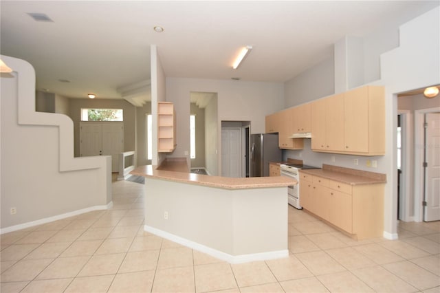 kitchen featuring light tile patterned floors, kitchen peninsula, stainless steel refrigerator, and white range with electric stovetop