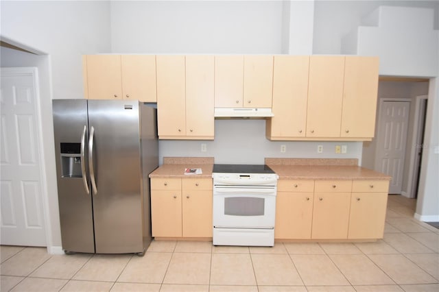 kitchen featuring white electric range, light tile patterned floors, stainless steel fridge with ice dispenser, and light brown cabinetry